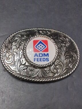 ADM Feeds Silver Toned Ornate Western Belt Buckle.